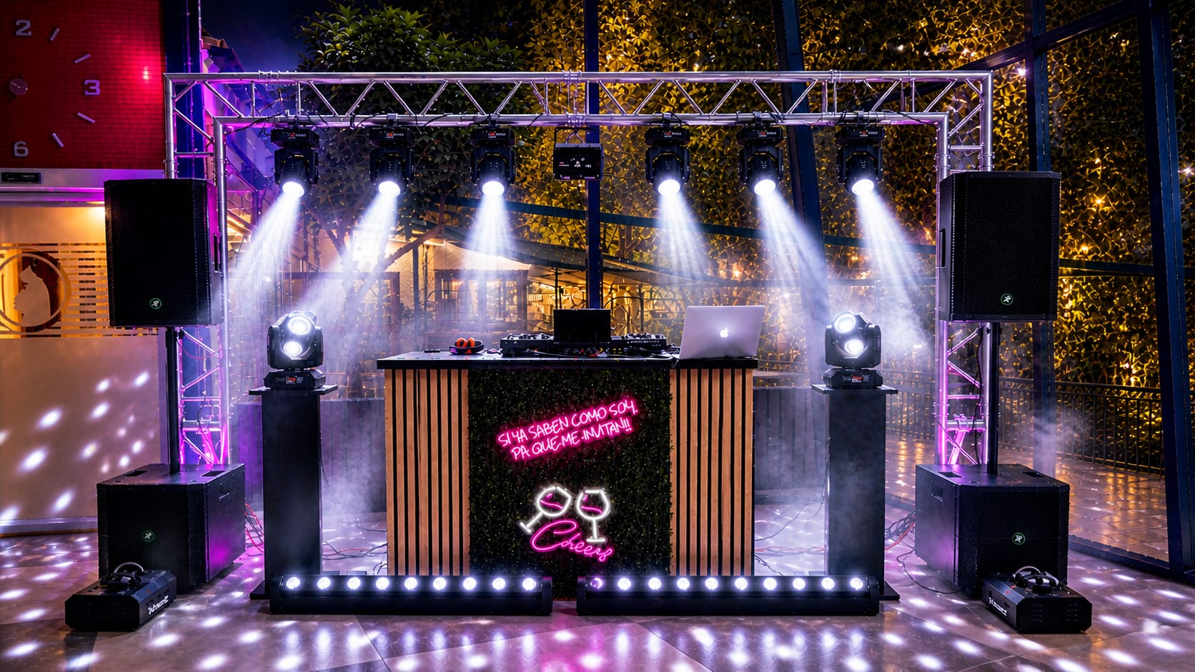 Cabina de DJ con iluminación decorativa y neón durante una boda